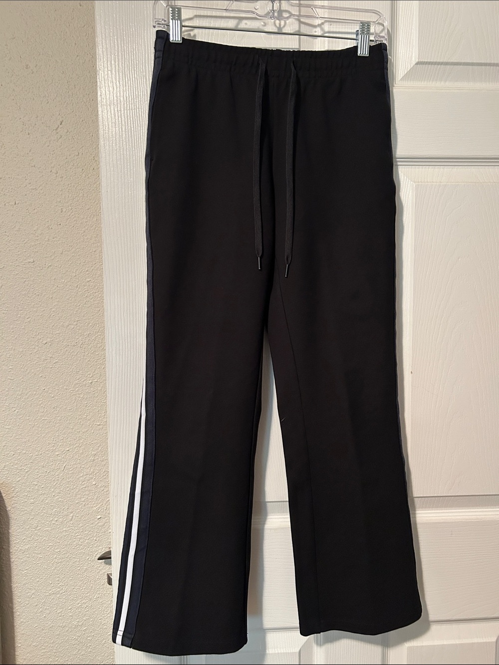 The Upside Black pants with White, Dark Navy and Black Side Stripes